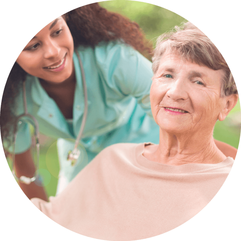 A nurse smiling with a patient