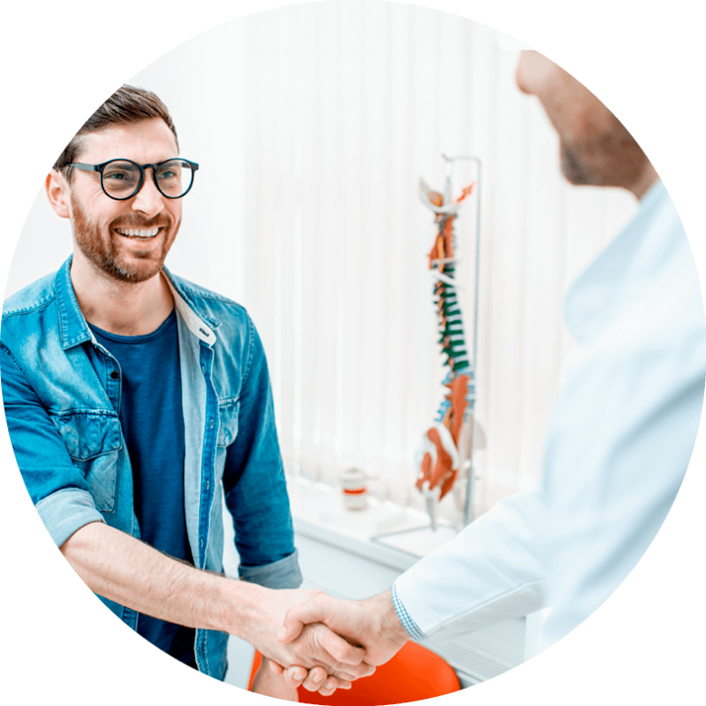 A man shaking hands with a healthcare professional