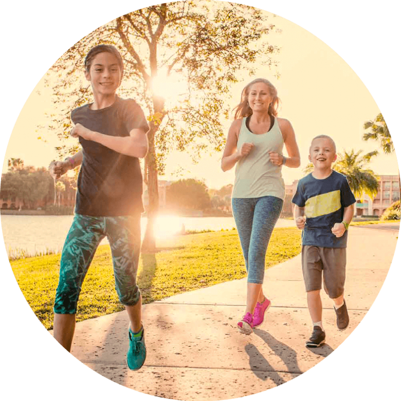 Two boys and lady having a run