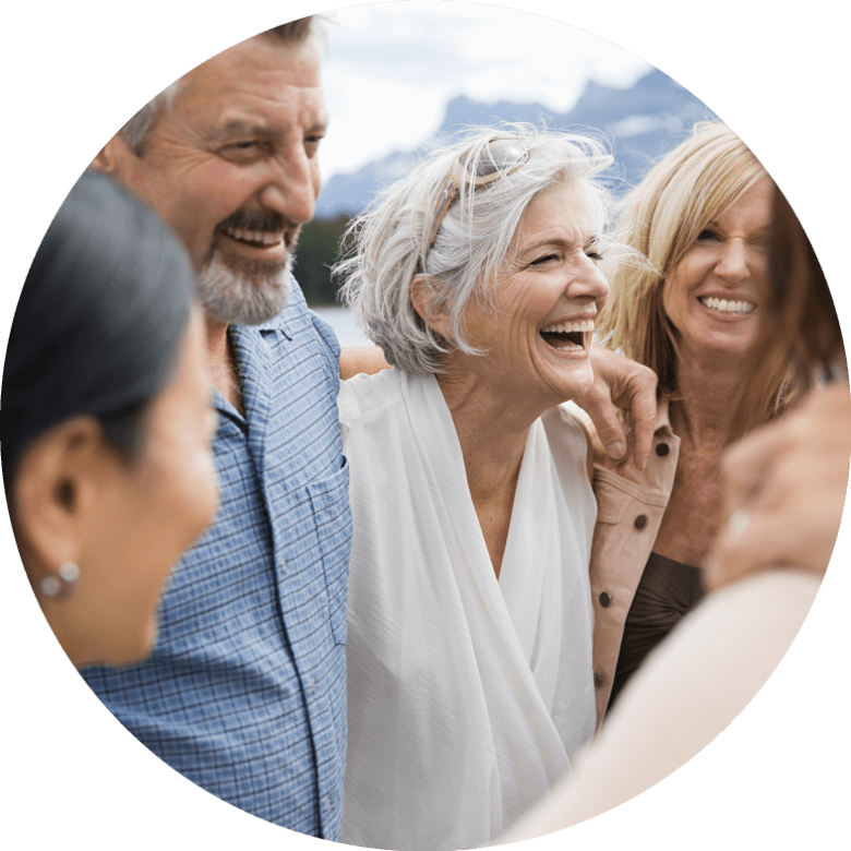 People in a group hug and laughing