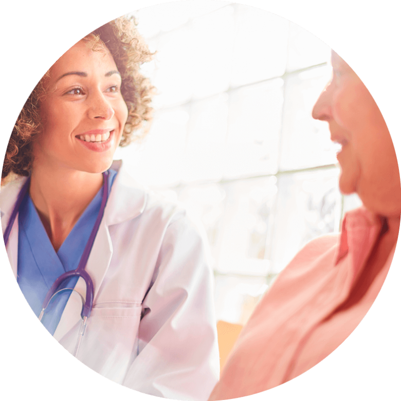 A nurse smiling with a patient